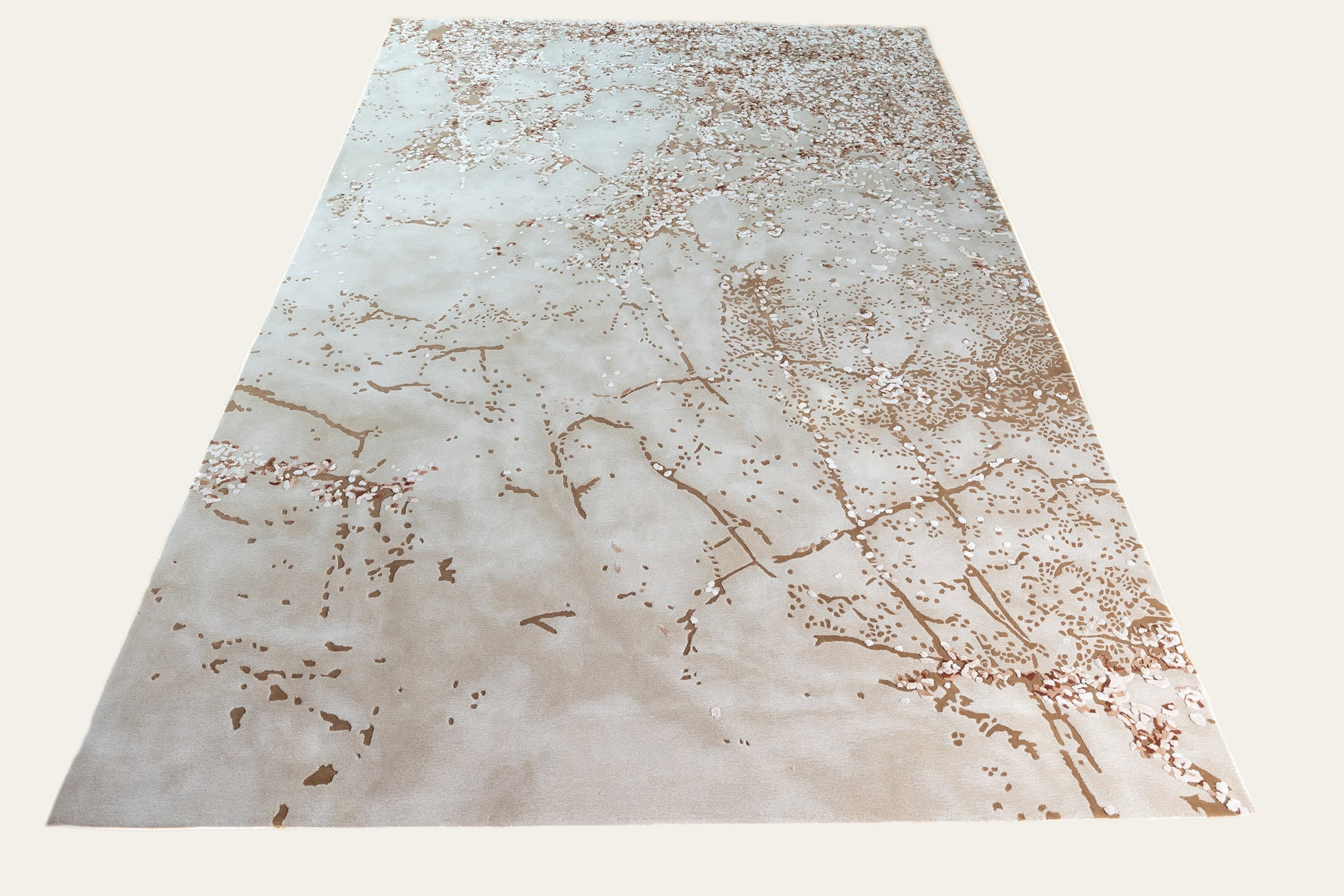 Marble-patterned rug with brown and beige colors on a white background