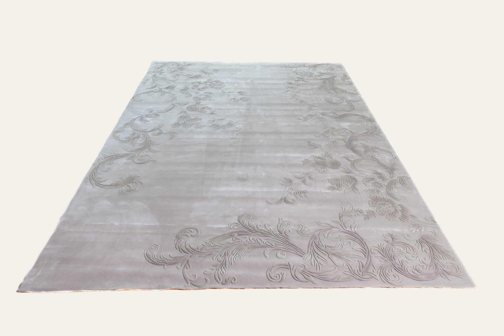 Decorative rug with intricate patterns on a white background