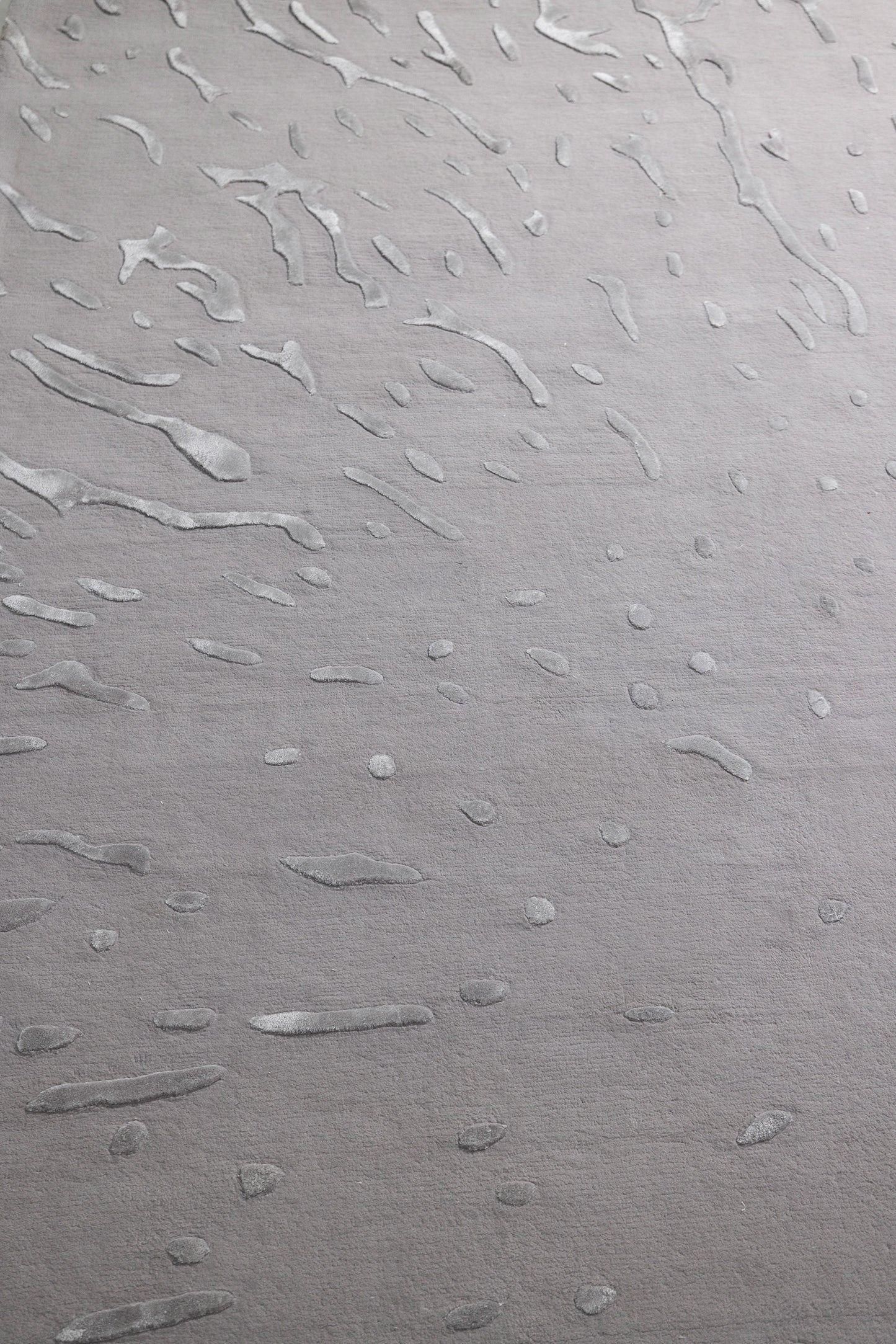 Textured gray surface with wavy patterns