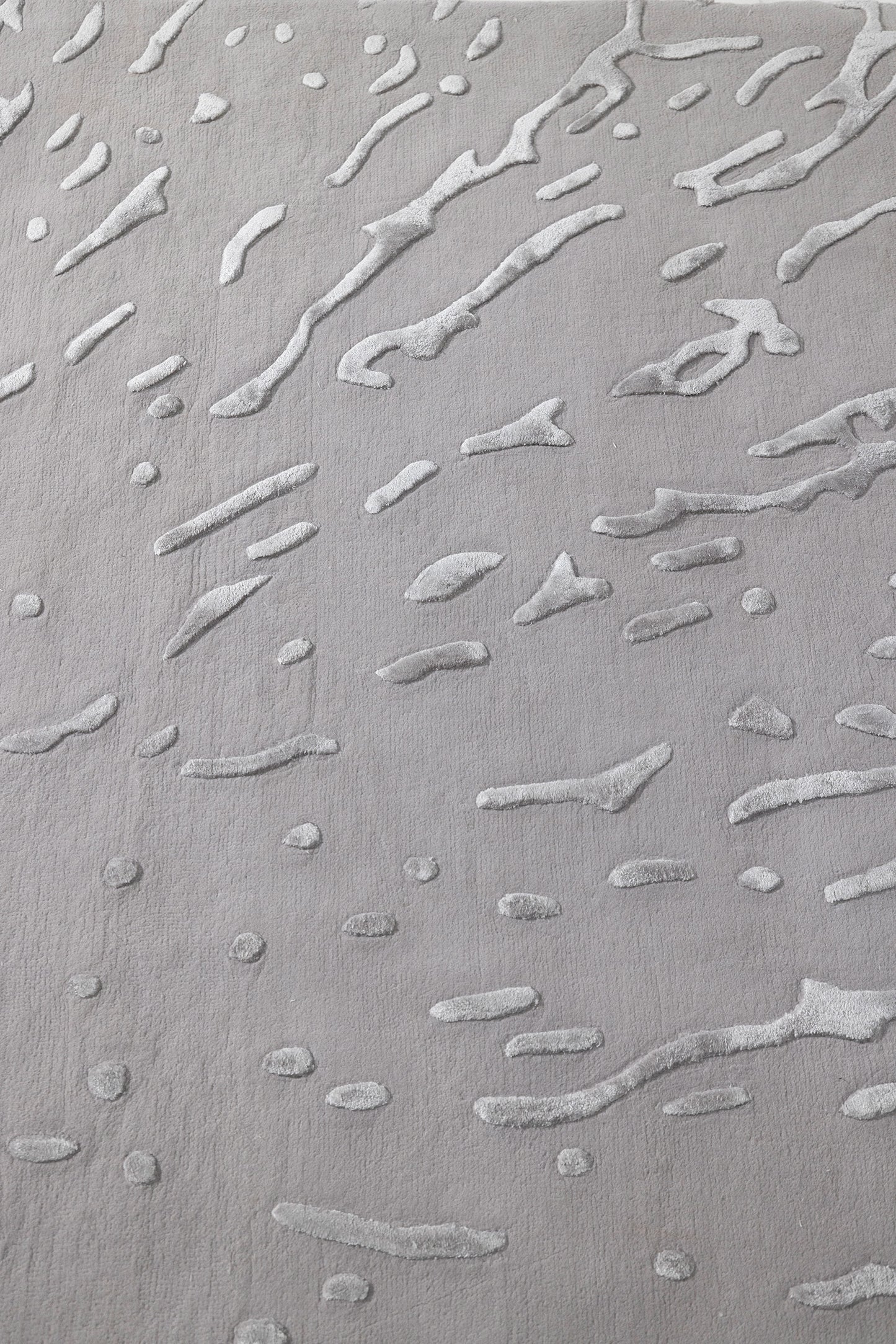 Textured gray surface with wavy patterns