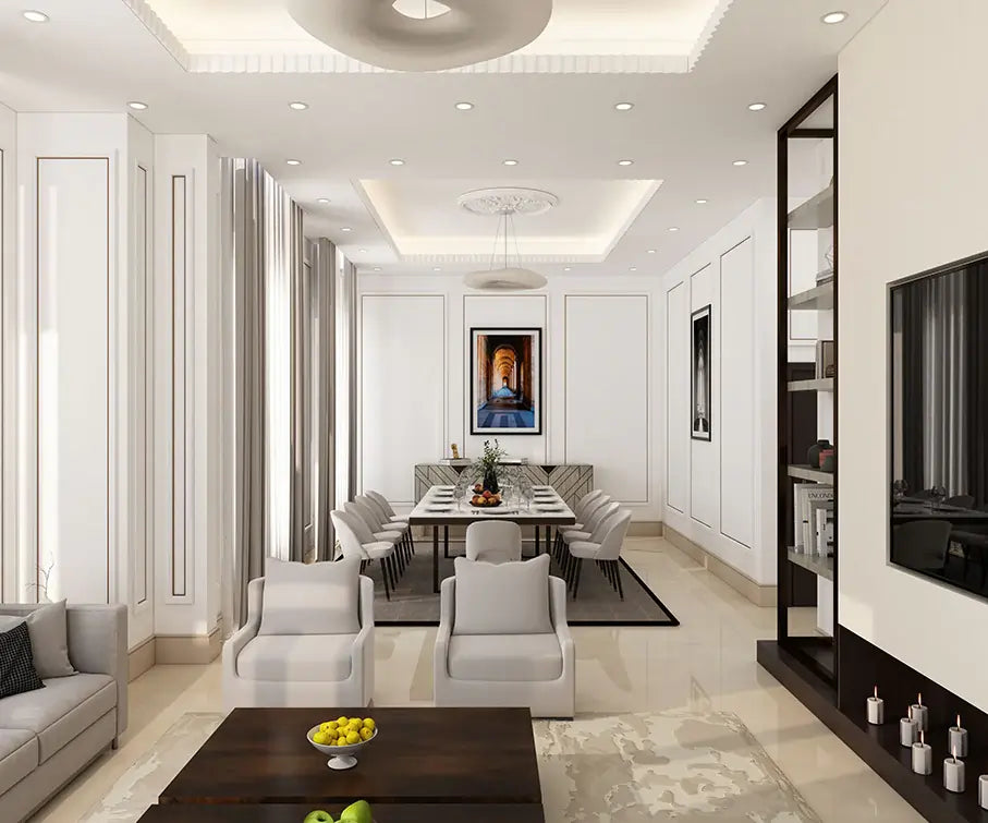 Spacious modern living room with a dining table, comfortable seating, a TV wall unit, and a fireplace. The room features a neutral color palette with white walls, light-colored furniture, and a few pops of color.