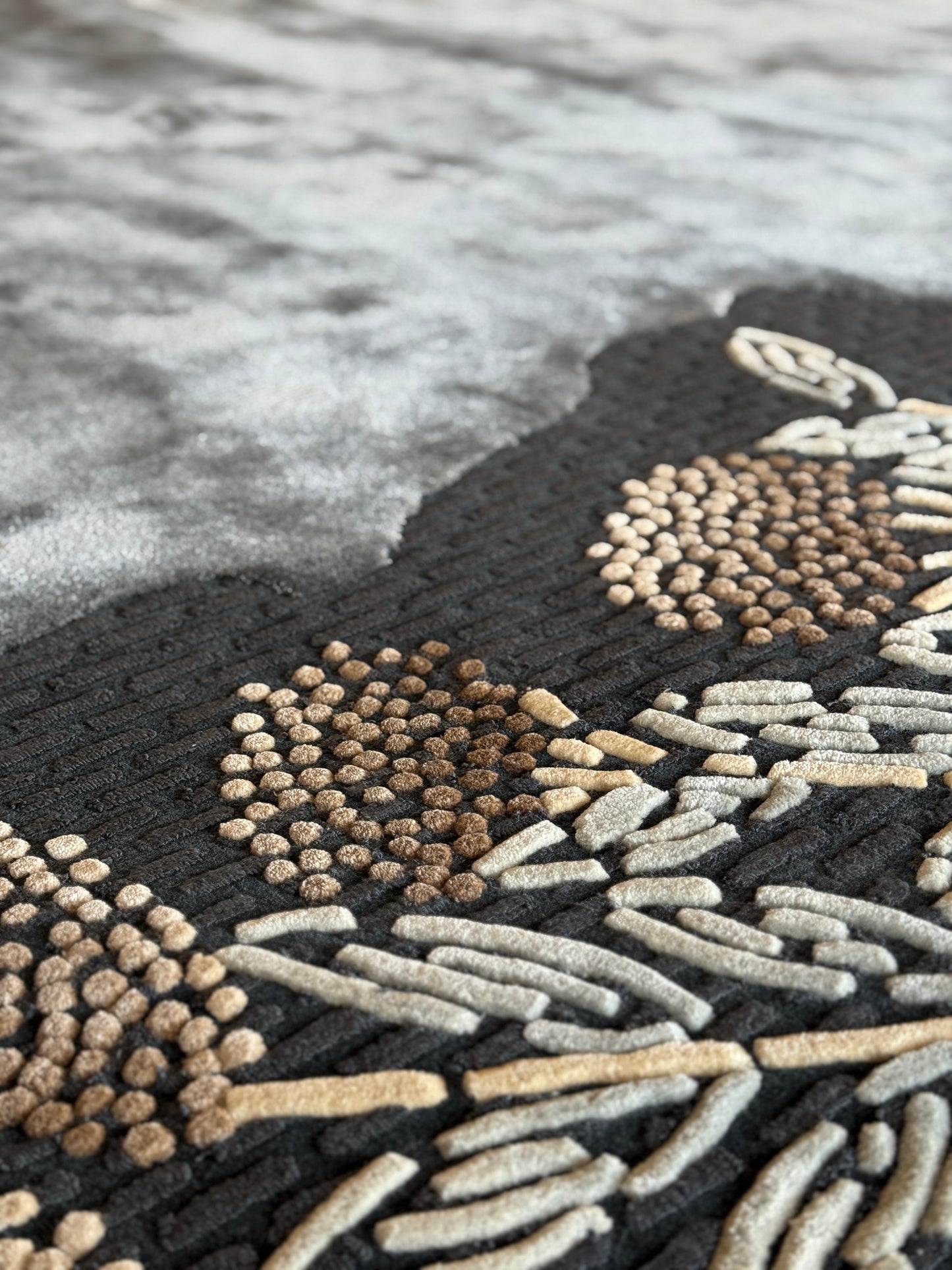 Close-up of a textured rug with geometric pattern