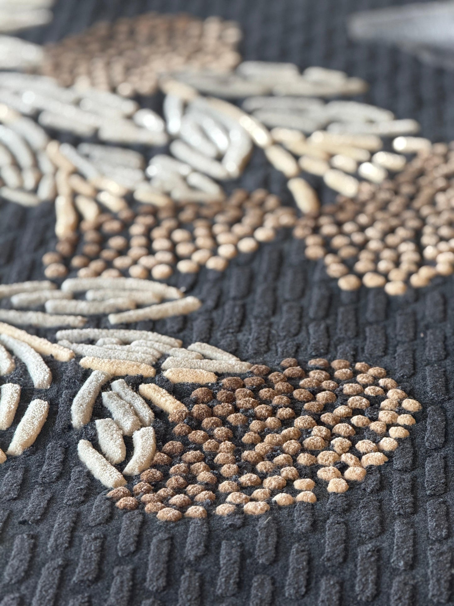 Close-up of a textured rug with geometric pattern