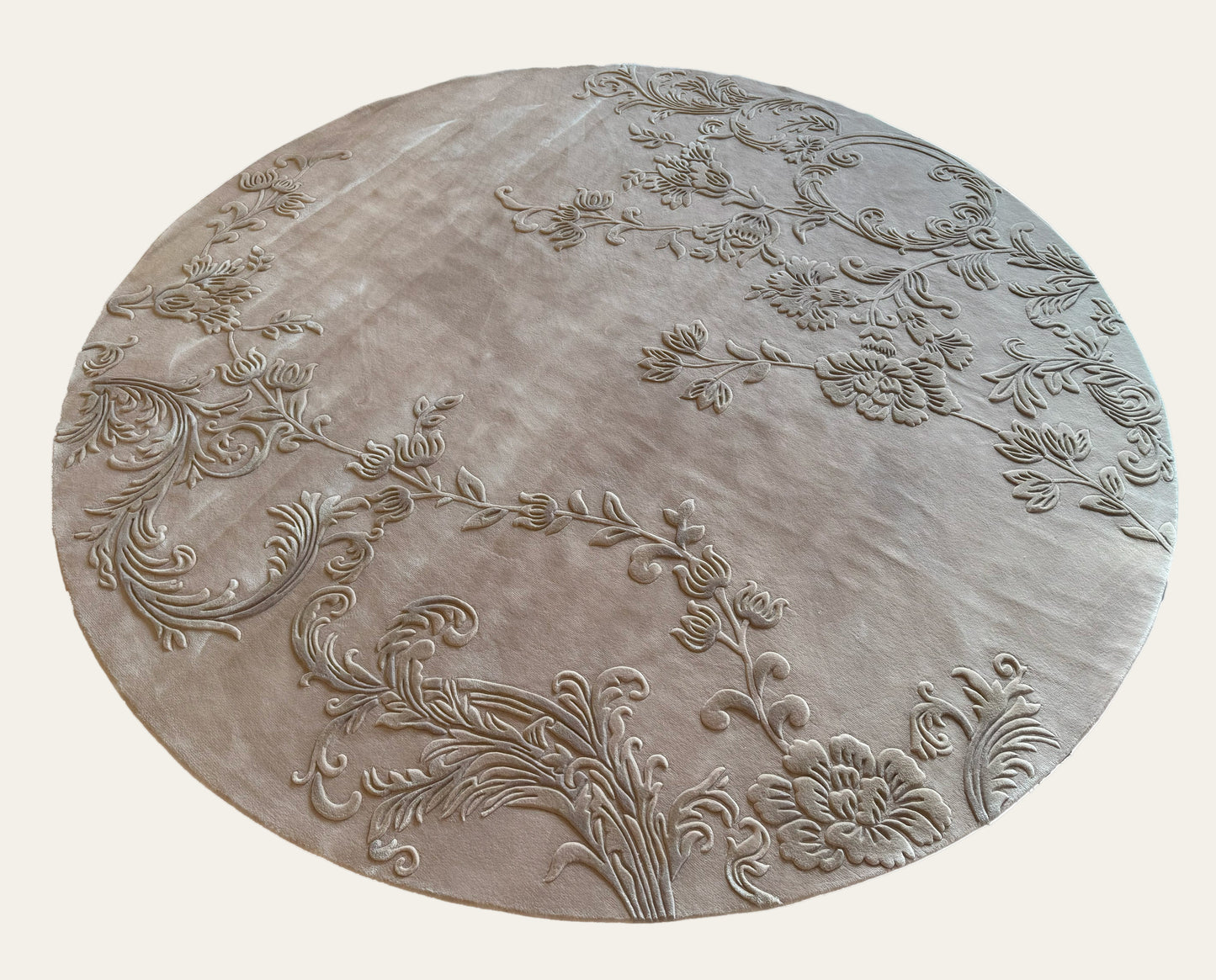 Decorative round stone with floral patterns on a white background