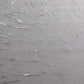 Textured gray surface with wavy patterns