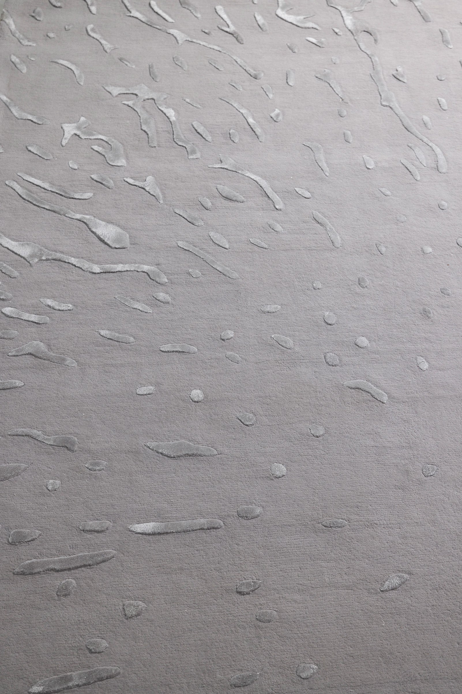 Textured gray surface with wavy patterns