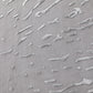 Textured gray surface with wavy patterns