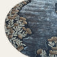 Round placemat with floral pattern on a white background