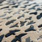 Close-up of textured surface with black and gray patterns