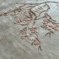 Textured surface with a branch and leaf design