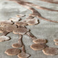 Textured brown shapes on a gray background