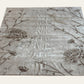 Decorative rug with floral and bird patterns on a plain background