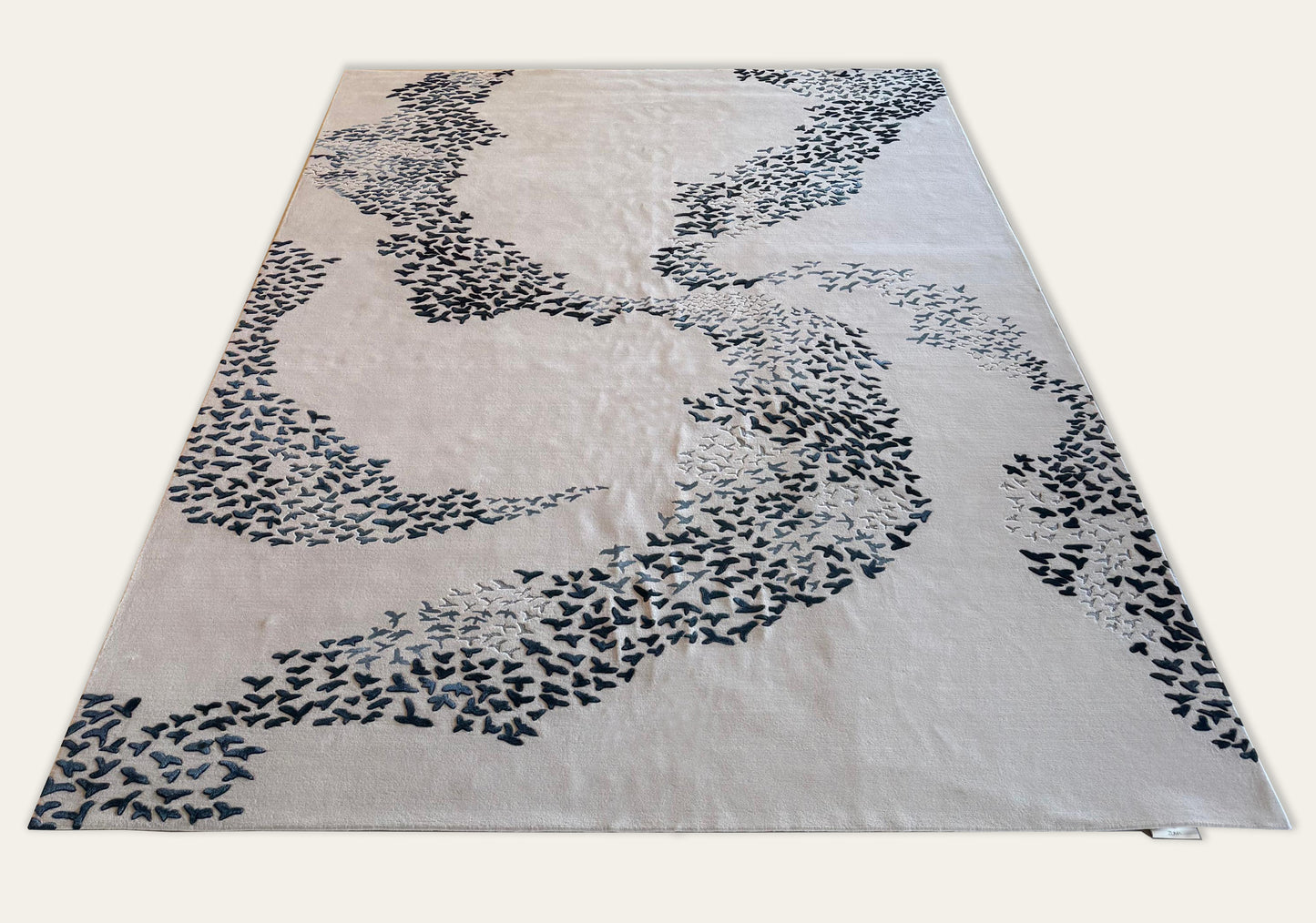 Rug with abstract black pattern on a white background